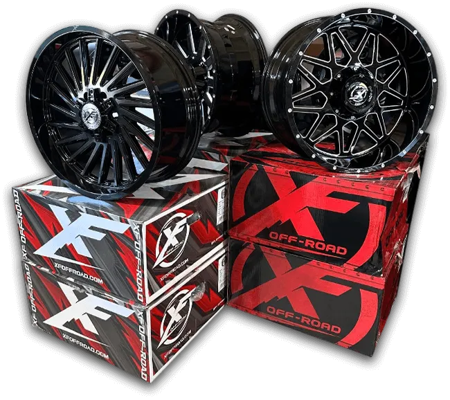 Stack of new car rims near Redfield, AR at Direct Customz, LLC